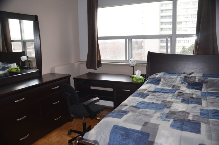 Bedroom with window in three bedroom apartment near Keele & Wilson - Humber River Apartments